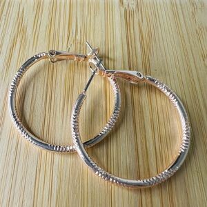 LC rose gold tone hoop earrings